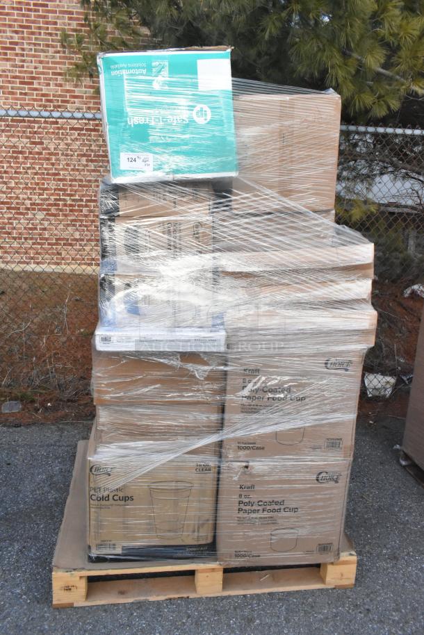 Pallet of 35 new scratch and dent items, including napkins, food cups, forks, and trash bags, wrapped for auction.