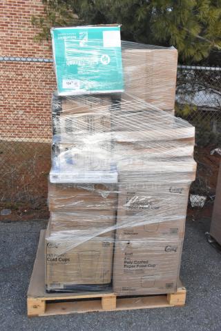 Pallet of 35 new scratch and dent items, including napkins, food cups, forks, and trash bags, wrapped for auction.