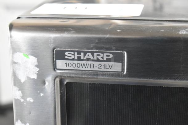 Sharp R-21LVF Commercial Microwave Oven, 1000W, 2021 model. Stainless steel; visible marks and wear. 120 Volts, 1 Phase.