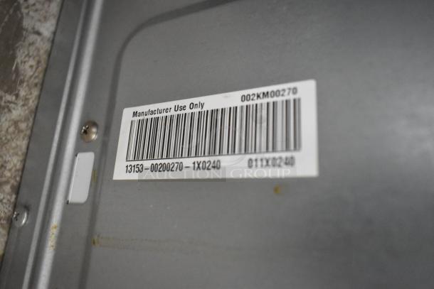 Barcoded label on Amana Commercial Countertop Microwave Oven, indicating manufacturer use only. Model details: 13153–00200270–1X0240.