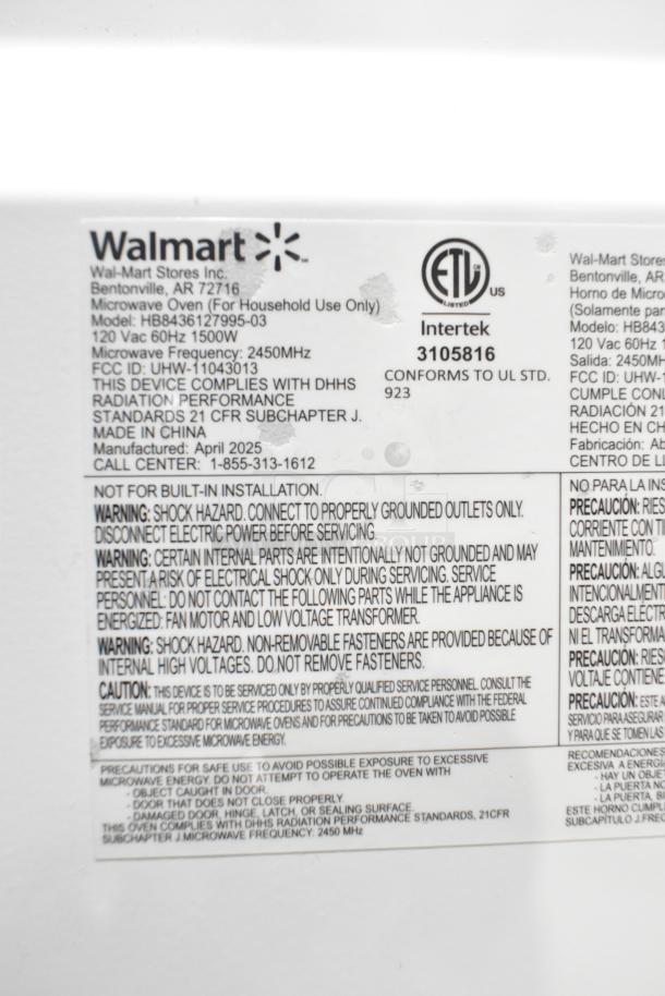 Label on Hamilton Beach HB8436127995-03 microwave showing model info, 120 volts, warnings, and compliance details.