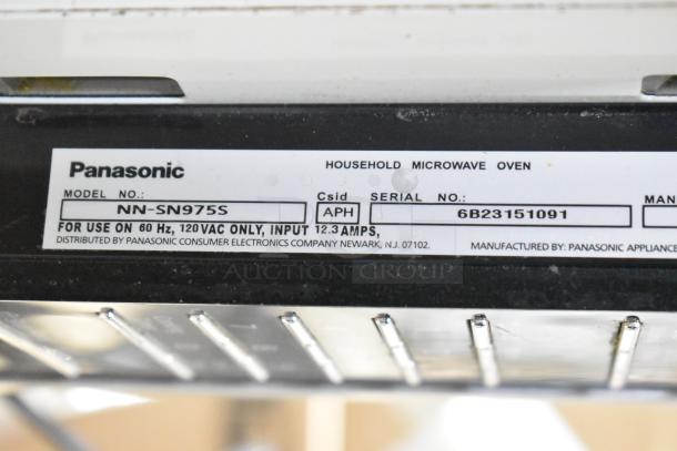 2023 Panasonic NN-SN975S Microwave Oven, model label showing serial number 6B23151091, 120V, 1 phase, includes plate.