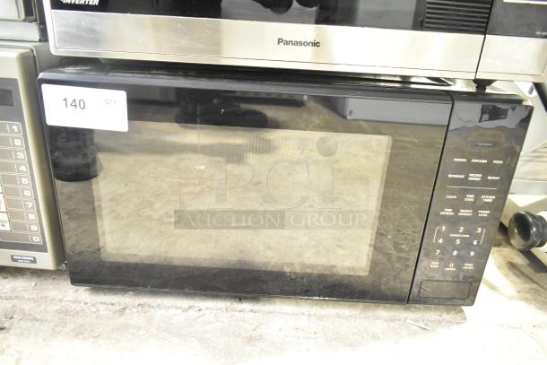 Mainstays MS8436193153-01 countertop microwave oven with plate, 120 volts, 1 phase. Black exterior, digital controls on side. Item tag marked "140 QTY."