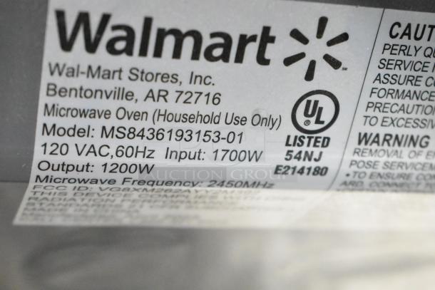 Mainstays MS8436193153-01 countertop microwave oven label showing model, 120V, 1700W input, 1200W output, UL listed.