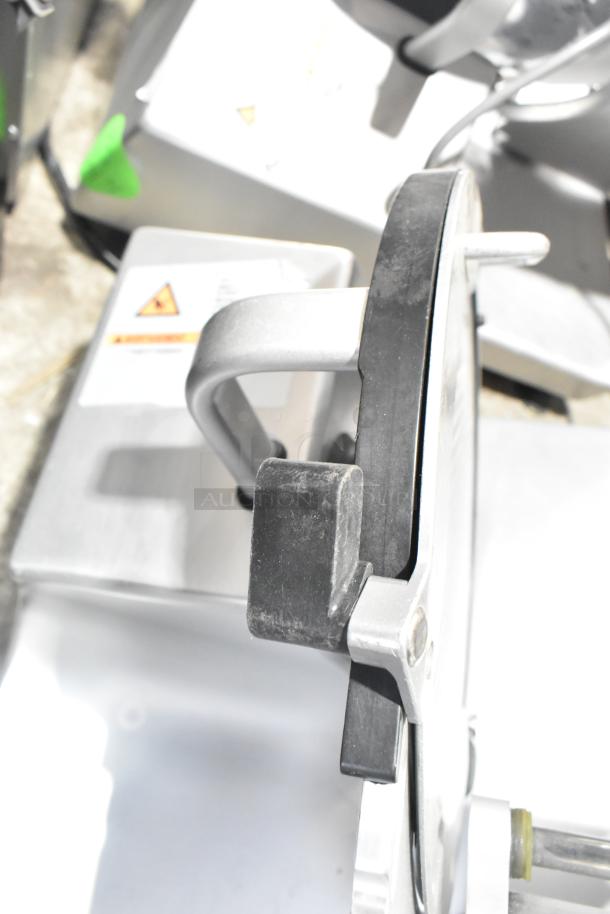 Bizerba GSP H commercial meat slicer, 120 volts, 1 phase. Features adjustable thickness, sturdy handle, and stainless finish.