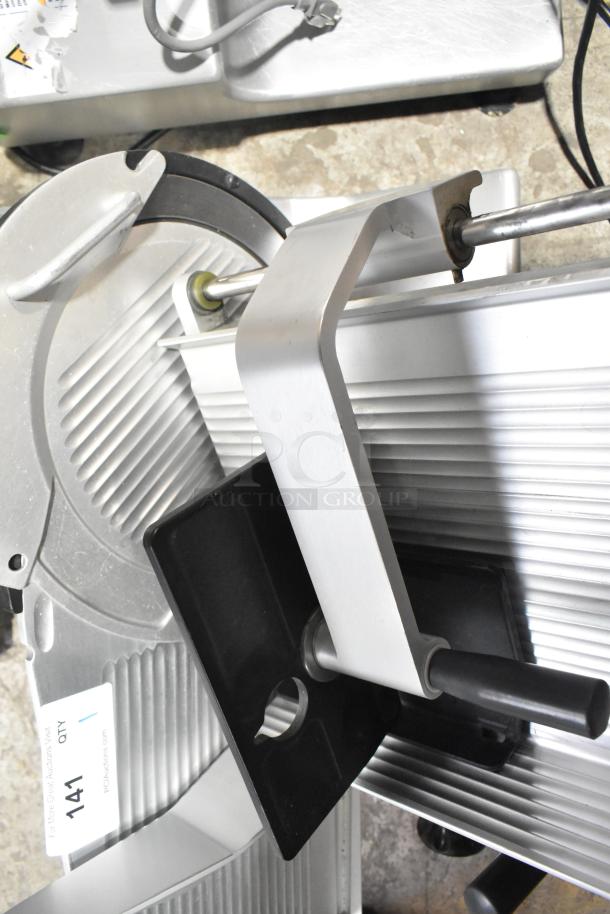 Bizerba GSP H commercial meat slicer, silver, excellent condition, 120 volts, 1 phase, visible auction tag labeled "141".