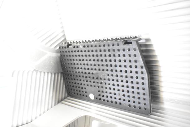 Bizerba GSP H Commercial Meat Slicer part, showing textured surface and blade detail, 120V, 1 Phase.