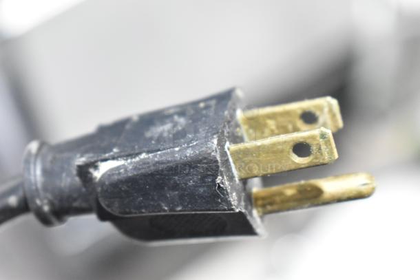 Close-up of a power plug for the Bizerba GSP H commercial meat slicer, showing its condition.