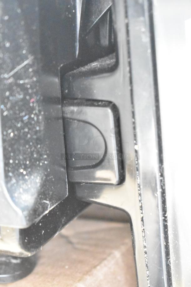 Close-up of a part of the 2019 Hobart HTi-7LH3 Commercial Countertop Scale, showing black plastic components.
