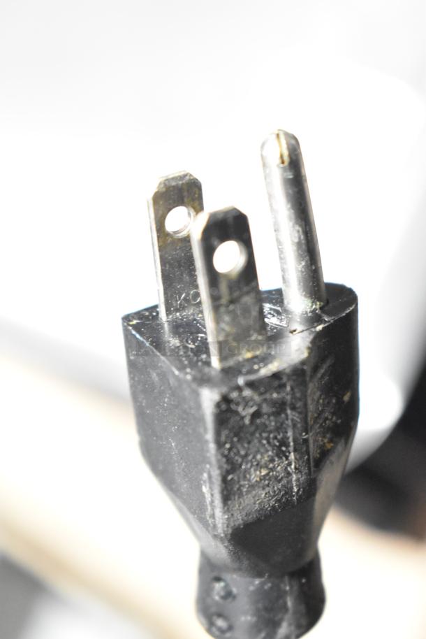 Close-up of the power plug for a 2019 Hobart HTi-7LH3 commercial countertop scale.