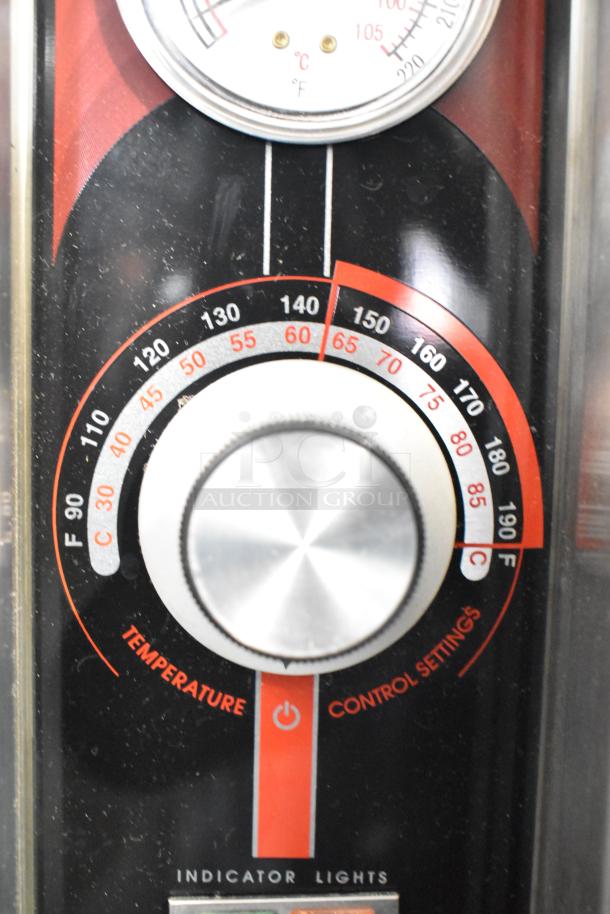 Close-up of the FWE TS-1633-36P heated cabinet's temperature control dial, displaying Fahrenheit and Celsius settings.