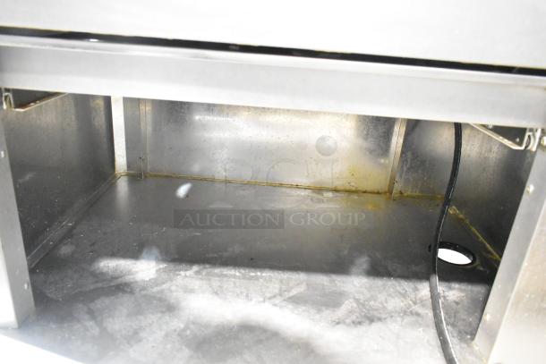 Fri-jado TDR7-P rotisserie oven interior view, highlighting metal surfaces and wiring. Note: Check for broken glass.