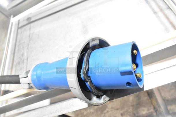 Belshaw Adamatic TG-50 commercial thermoglazing station power connection, showing a blue industrial plug.