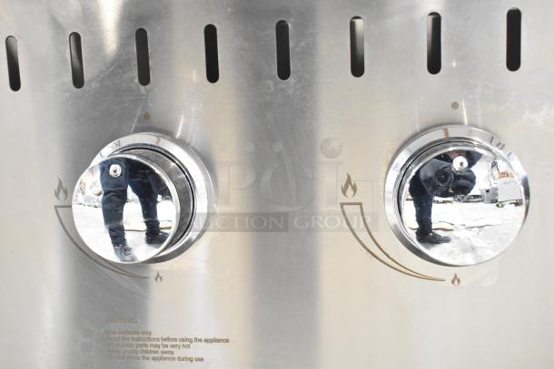 2024 Backyard Pro 554LPG36 36" stainless steel propane grill, new with cosmetic dents, dual control knobs visible.