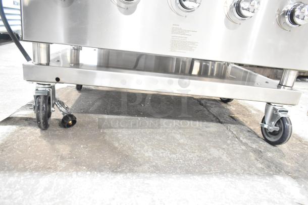 BRAND NEW Backyard Pro 554LPG36 36" stainless steel propane grill; features heavy-duty wheels for mobility. Scratch and dent.