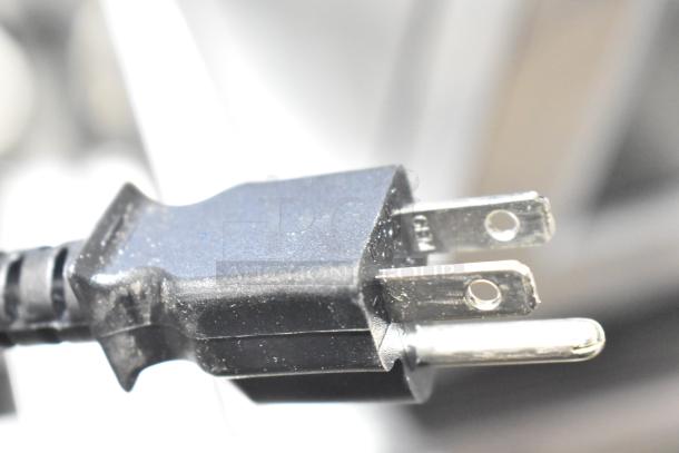 Close-up of the plug for a Mettler Toledo FreshWay AM-6127C Commercial Countertop Scale, 120/208-240 Volts.