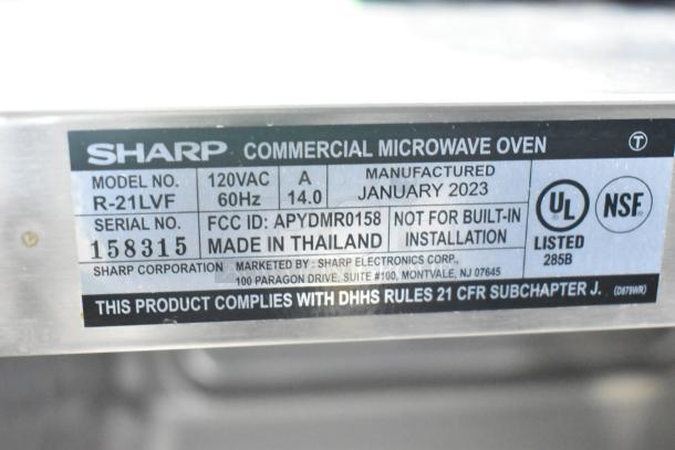 2023 Sharp R-21LVF commercial microwave oven, 120 Volts, serial 158315, made in Thailand, NSF, and UL listed.
