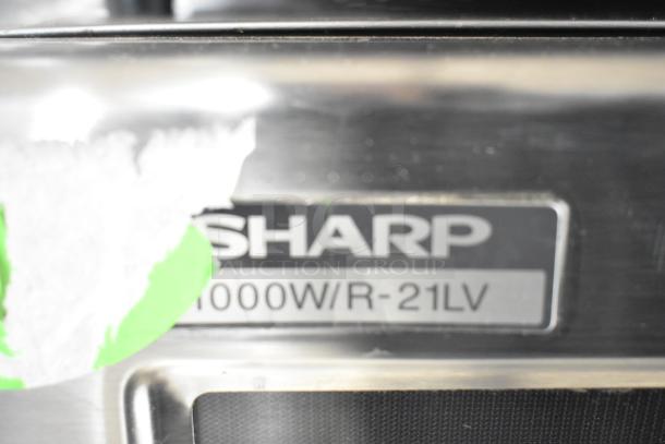 2022 Sharp R-21LVF Commercial Microwave, 1000W, 120 Volts, with visible branding label, slightly worn exterior.