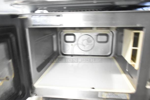 2022 Sharp R-21LVF commercial countertop microwave, 120 volts, 1 phase. Clean interior. Model details visible inside.