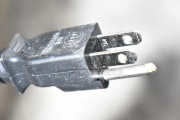 Close-up of a power plug for a Sharp R-21LVF Commercial Microwave Oven, 120 volts, one phase.