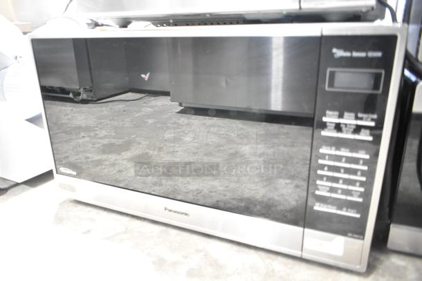 2020 Panasonic NN-SN975S countertop microwave oven with plate, 120 volts, 1 phase; sleek design, digital controls.
