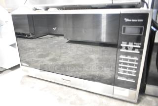 2020 Panasonic NN-SN975S countertop microwave oven with plate, 120 volts, 1 phase; sleek design, digital controls.