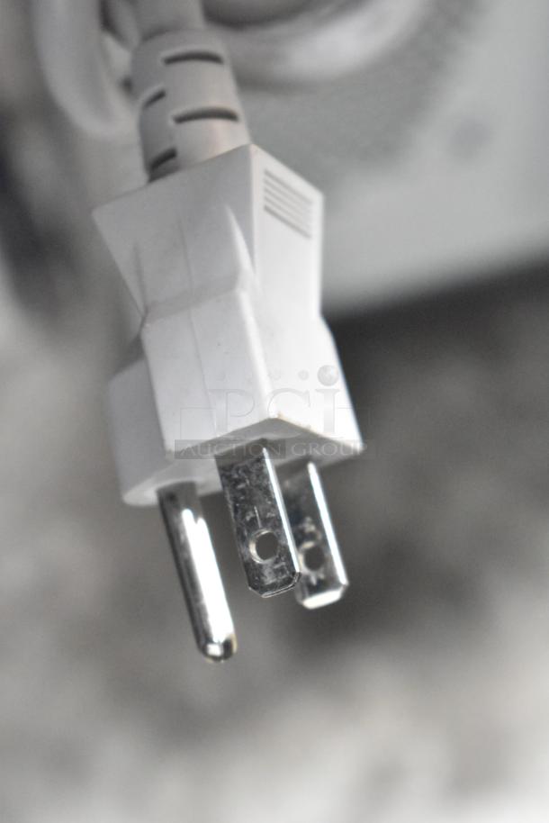 2020 Panasonic NN-SN975S microwave plug, close-up view, three-prong design, 120 volts, 1 phase configuration.