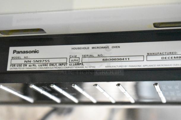 2020 Panasonic NN-SN975S Microwave Oven label showing model, serial number, voltage, and manufacturing details.