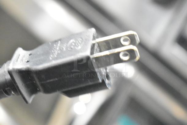 Close-up of a power plug for the 2023 Sharp R-21LVF Commercial Microwave Oven. 120 Volts, 1 Phase.