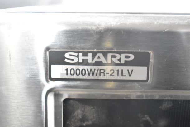 2023 Sharp R-21LVF Commercial Countertop Microwave Oven in stainless steel, visible label states "1000W/R-21LV."