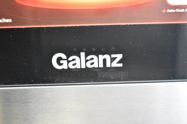 Galanz countertop microwave oven, model 667126859, used as display. No power cord included. 120 volts, 1 phase. Logo on front.