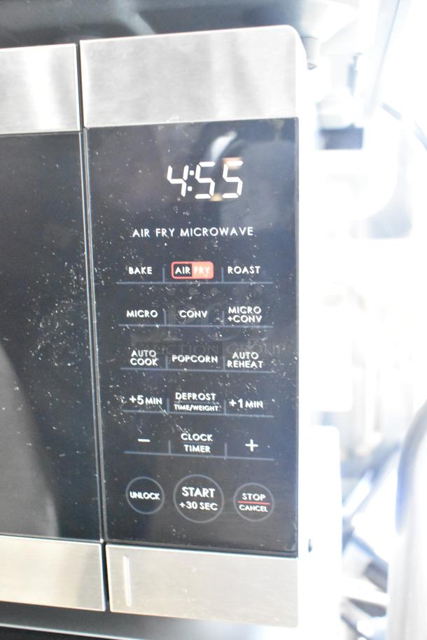 Galanz countertop microwave oven model 667126859 with an air fry feature, used display, lacks power cord, 120V, 1 phase.