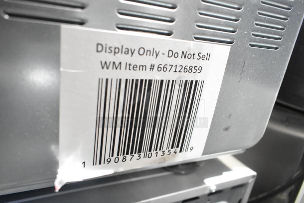 Galanz 667126859 countertop microwave oven, display unit, lacks power cord, labeled "Display Only - Do Not Sell."