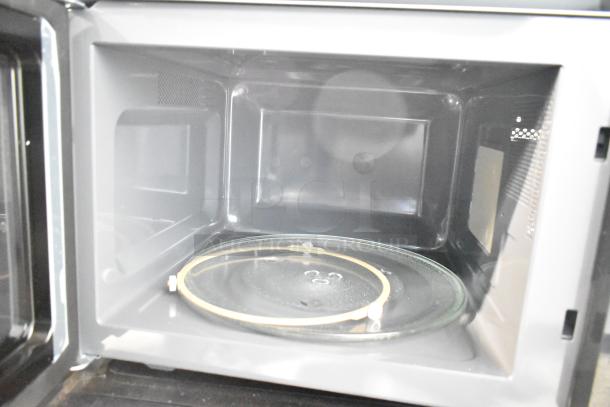 Panasonic countertop microwave oven, used display unit, no power cord, 120 volts, 1 phase, interior view.