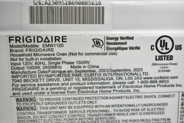 Frigidaire EMW1120 countertop microwave, display model, no power cord, 120V, 1000W, made in China, September 2023.