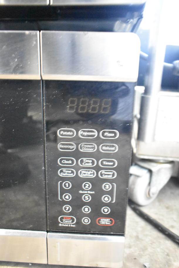 Frigidaire EMW1120 countertop microwave oven, used display model, missing power cord, 120V, 1 phase.