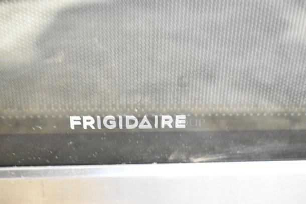 Frigidaire EMW1120 countertop microwave, used as display, no power cord, 120V, 1 phase, visible logo on door.