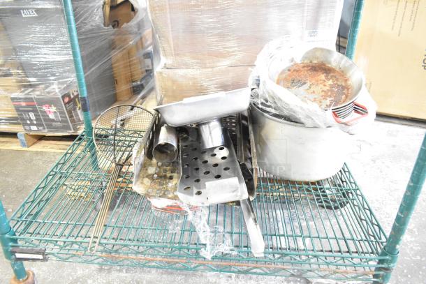 Tier lot of household items on metal shelf, including skillets, bowls, a coffee pot, and a metal pot; mixed condition.