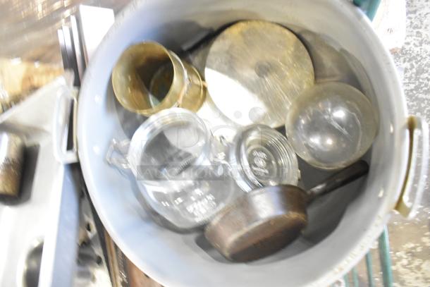 Auction lot of mixed kitchen items including skillets, bowls, coffee pot, and metal pot. Items show various wear.