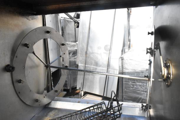 Fri-jado TDR7-P commercial rotisserie oven interior. Electric, 208V, 3 phase, on casters. Clean, well-maintained condition.