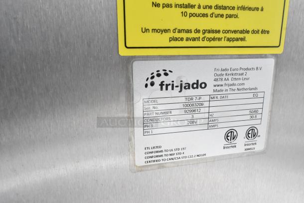 Fri-jado TDR7-P rotisserie oven label showing model, serial number 100083209, 208V, 3-phase, ETL and NSF certifications.