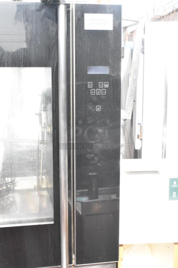 Fri-jado TDR7-P commercial rotisserie oven on casters, 208V, 3-phase; features digital controls, sturdy frame, good condition.