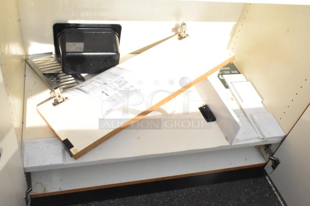 Trash Can Shell with hinged wooden panel and black plastic insert, shows light wear. Some paperwork and installation components visible.