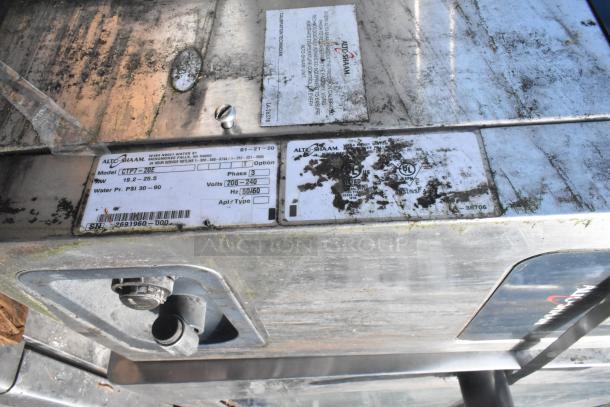 Alto Shaam CTP7-20E combi oven label showing model info, 208-240V, 3-phase; stainless steel surface visible.