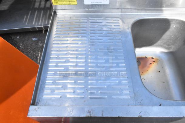 Krowne 18-43R Commercial 3 Bay Sink with left drain board, visible wear, includes faucet and handles.