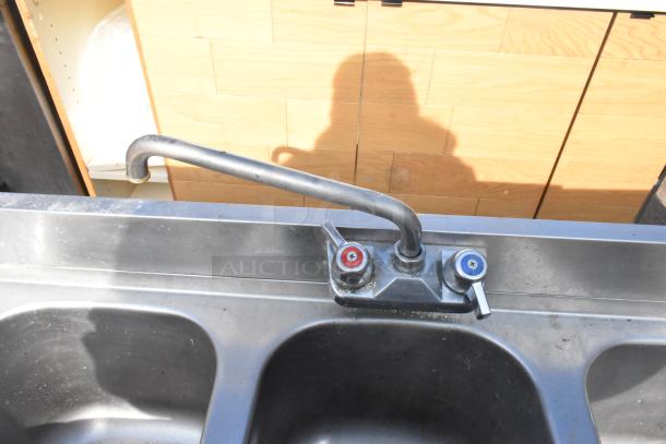 Krowne 18-43R commercial 3 bay back bar sink with left side drain board, faucet, and handles. Stainless steel, used.