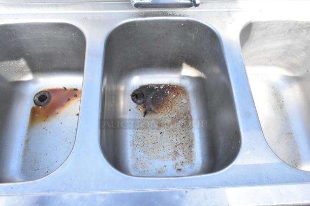 Krowne 18-43R commercial 3 bay back bar sink with left side drain board, faucet, and handles. Visible rust and wear.