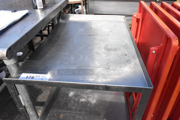3 Tier metal cart on commercial casters, slightly worn, with visible tag "175." Suitable for industrial use.