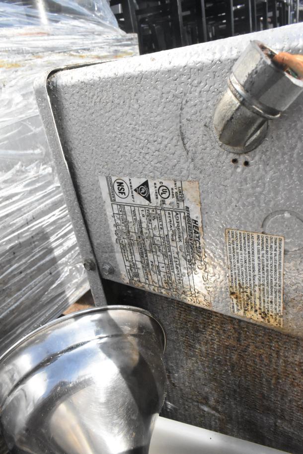 Pallet lot with evaporator unit displaying NSF, UL labels, visible wear; includes high chairs, trash can, skillets.