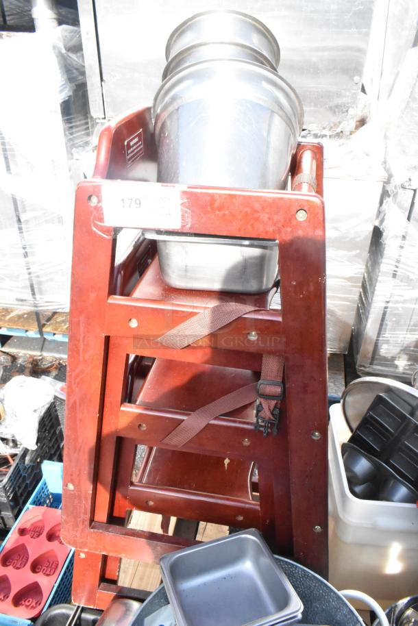 Pallet lot with evaporator, wooden high chairs, trash can, skillets, and various kitchen items. Visible price tag. 